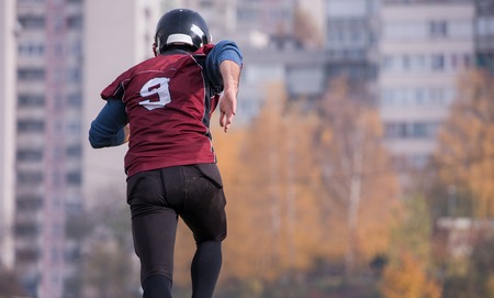 young american football player in action during the training at fieldの写真素材