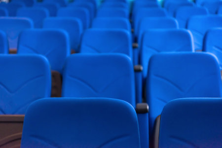 Empty conference,theater or cinema hall with rows of blue seats