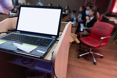 Laptop computer at podium on business seminar education  in modern conference roomの写真素材