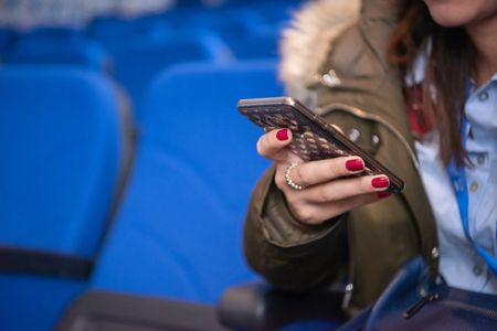 Business people hands typing on smart phone during the seminar at conference roomの写真素材