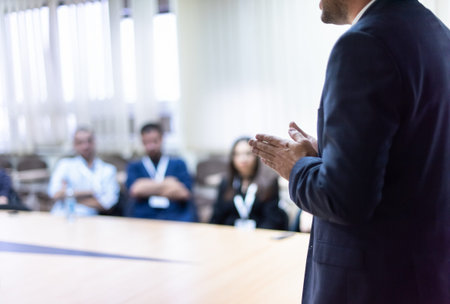 Young businessman at business conference room with public giving presentations.の写真素材