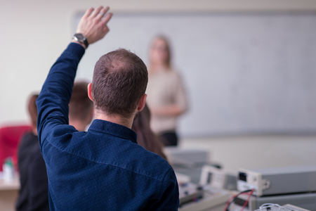 Group of young students doing technical vocational practice with teacher in the electronic classroom, Education and technology concept