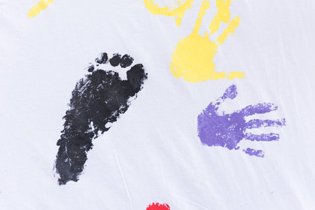 child colorful hands and foots print on white background