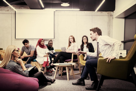Multiethnic startup business team on meeting in modern bright office interior brainstorming, working...