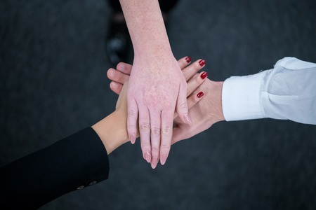 multiethnic Group of young business people celebrating success at their working places in startup office success and winning conceptの写真素材