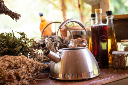Herbalist workshop with bottles and healing herbsの写真素材