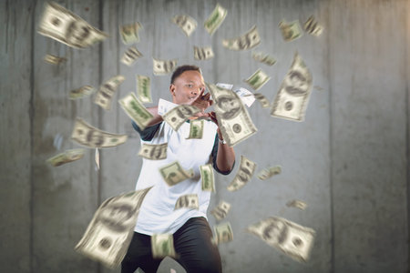 business, people and finances concept  Happy young african american businessman throwing US dollar...