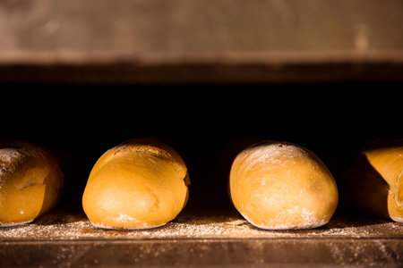 Bread bakery food factory production with fresh products   Baked bread in the bakery, just out of...
