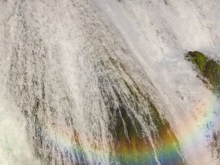 waterfall in beautiful nature with crystal clear water on wild river una in bosnia and herzegovina at sunny summer dayの写真素材
