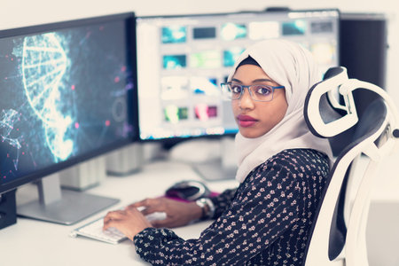 young afro american modern  muslim business woman wearing scarf on creative bright  office workplace...