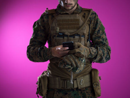 army soldier using smartphone to contact family or girlfriend communication and nostalgia concept...
