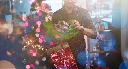 new year and christmas office party close up details food preparing and eating drinks and gifts authentic local startup business teamの写真素材