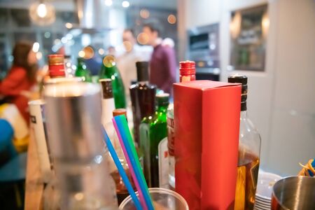 new year and christmas office party close up details food preparing and eating drinks and gifts authentic local startup business teamの写真素材