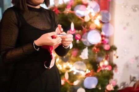 new year and christmas office party close up details food preparing and eating drinks and gifts authentic local startup business teamの写真素材