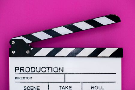video production movie clapper cinema action and cut concept isolated on pink purple violet backgroundの写真素材