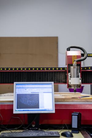 wood milling on modern automatic woodworking machine with CNC. furniture production.の写真素材