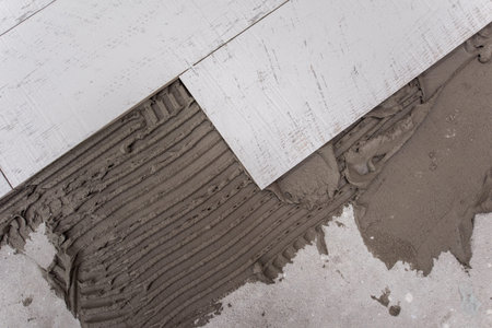 Ceramic wood effect tiles and tools for tiler on the floor  unfinished laying floor tiles  Floor...