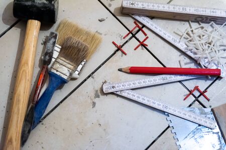 Ceramic tiles and tools for tiler  ceramic tiles installation  Home improvement, renovation   ceramic tile adhesive, mortar, levelの写真素材