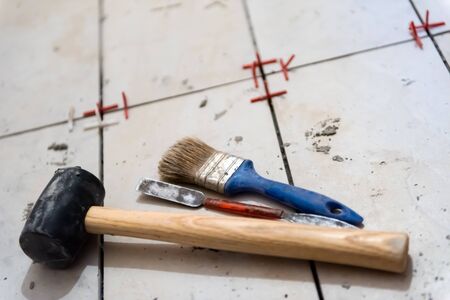 Ceramic tiles and tools for tiler  ceramic tiles installation  Home improvement, renovation   ceramic tile adhesive, mortar, levelの写真素材