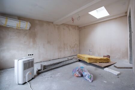interior of construction site with drywall completely installed at new two level apartment  work in progress to the new houseの写真素材