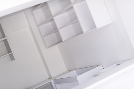 work in progress on the beautiful modern bright clean unfinished kitchen interior in new luxury home with wooden cupboardsの写真素材