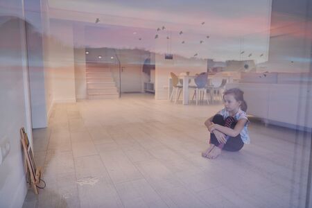 Little girl have online training over  tablet and doing modern ballet dance exercise at home. Online education concept class in modern ballet school. Social distance during quarantine, self-isolation in coronavirusの写真素材