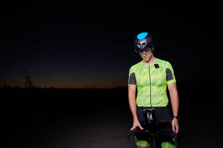 triathlon athlete portrait while resting on bike training