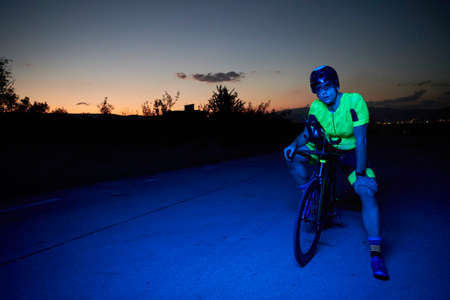 triathlon athlete portrait while resting on bike trainingの写真素材