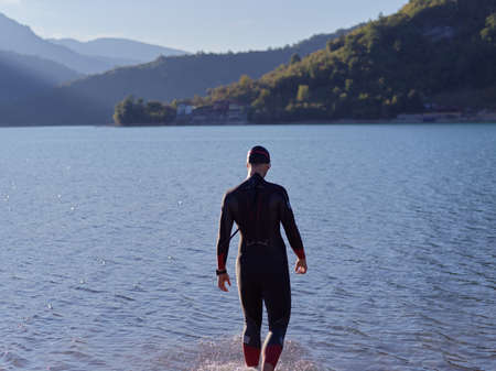 triathlete swimmer portrait wearing wetsuit on trainingの写真素材