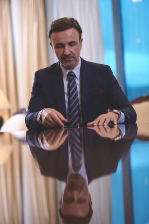 business man using smart phone at luxury office