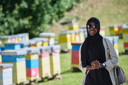 african muslim businesswoman portrait on small local honey production farm