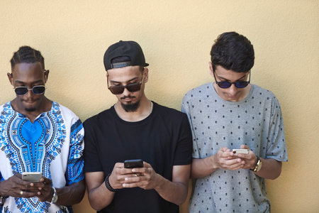 multiethnic startup business people group using smart phonesの写真素材
