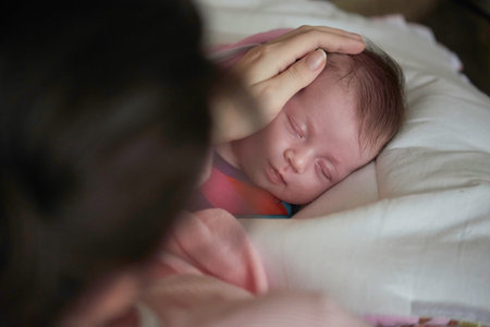 new born baby sleeping and in dreams smillling