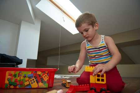 Little boy child playing with creative toys