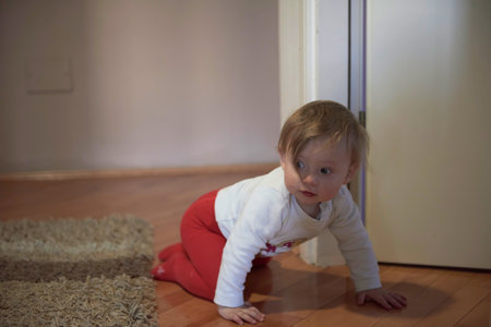 cute little one year old baby and making first stepsの写真素材