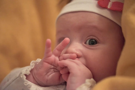 portrait of happy newborn little baby smilling