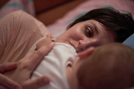 mother is playing with baby at homeの写真素材