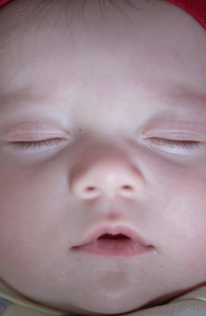 newborn baby sleeping at home in bed