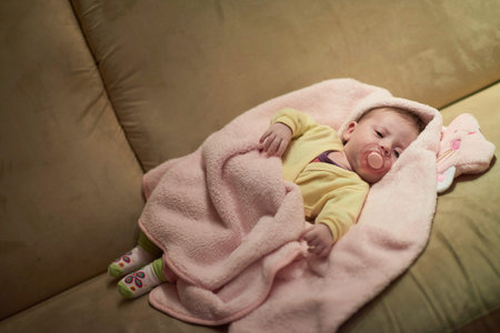newborn baby sleeping at home in bed