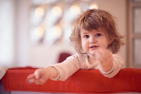 little baby girl with strange hairstyle and curlers