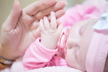 mother is playing with baby at homeの写真素材