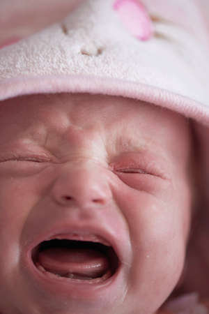 newborn baby crying and screamingの写真素材