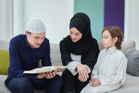Young muslim family reading Quran during Ramadan