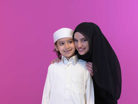 young arabian mother and son wearing traditional clothesの写真素材