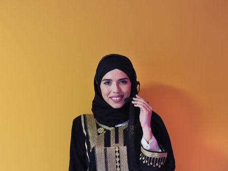 Portrait of young muslim woman with headphonesの写真素材