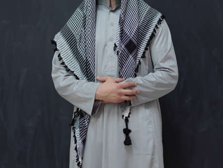 Portrait of young muslim man wearing traditional clothesの写真素材