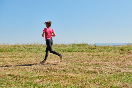 woman enjoying in a healthy lifestyle while joggingの写真素材