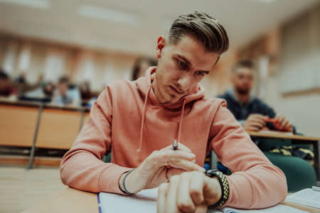 the student uses a smartwatch in math classの写真素材