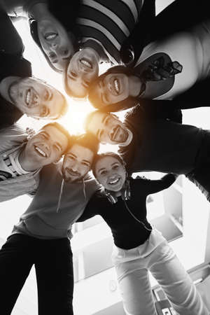 group of happy young people showing their unityの写真素材