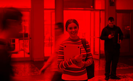famel student with modern technology in school